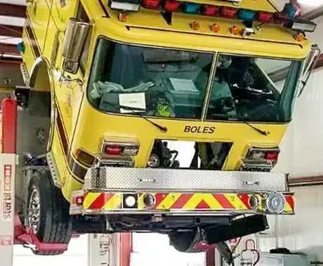 Fire apparatus undergoing preventative maintenance to improve reliability, safety, and operational readiness.