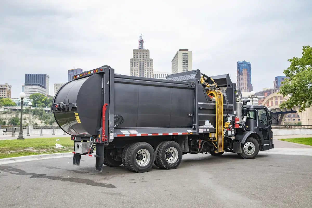 McNeilus ZR automated side loader supporting municipal waste collection and environmental services that keep communities operating year-round.