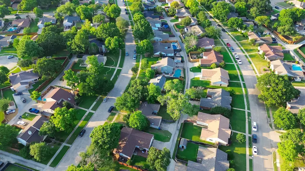 Aerial view of a residential community representing the cities, municipalities, and neighborhoods supported by MacQueen's environmental and emergency solutions.